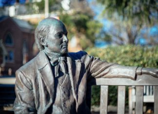 What should I do when a health issue disrupts my classes? | Ask Kelly statue of jesse mercer sitting on a bench