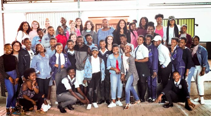 Changing lives, one mission at a time MOM South Africa participants are pictured with Cape Town high school students.