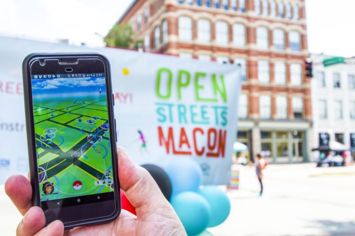(Photo courtesy of Stephen Cook) Using the Pokemon Go app as their guide, participants found 10 physical locations in downtown Macon on Oct. 7 and answered questions at the “PokeStops.”