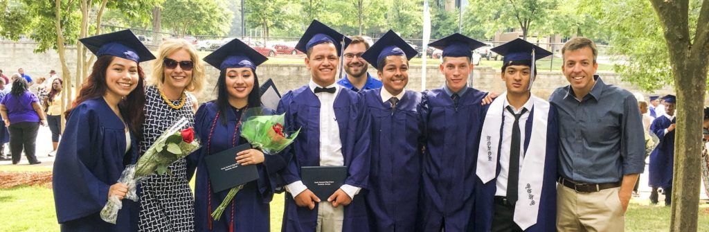 From left, Lupe Sevilla, Path Project co-founder Melinda Hollandsworth, Sophia Abara, Emmanual Soto, Path Project team member MacKenzie McKay, Bryan Sanchez, Luis Garcia, an unidentified student not in program, and Path Project co-founder Jim Hollandsworth are shown at South Gwinnett High School’s graduation in May 2016.