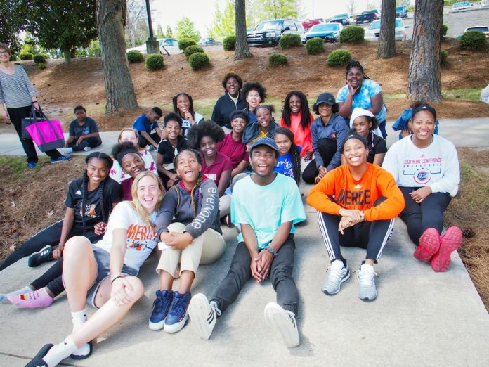 Mercer University students and Ballard Hudson Middle students in the Mercer Mentors program are pictured during a campus visit in April.