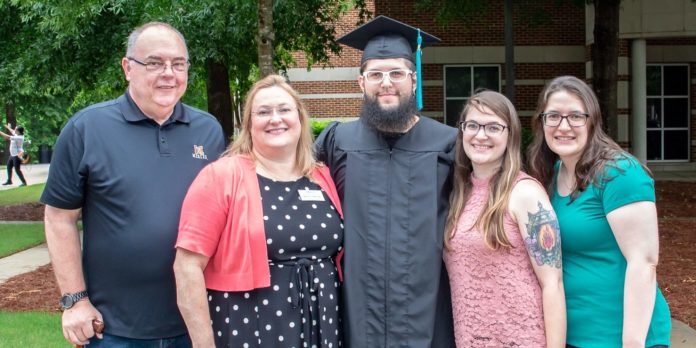 From left, Dave and Brenda Phillips are pictured with their children, Daniel, Anna and Michelle at Daniel's graduation from Mercer in Atlanta on May 11.