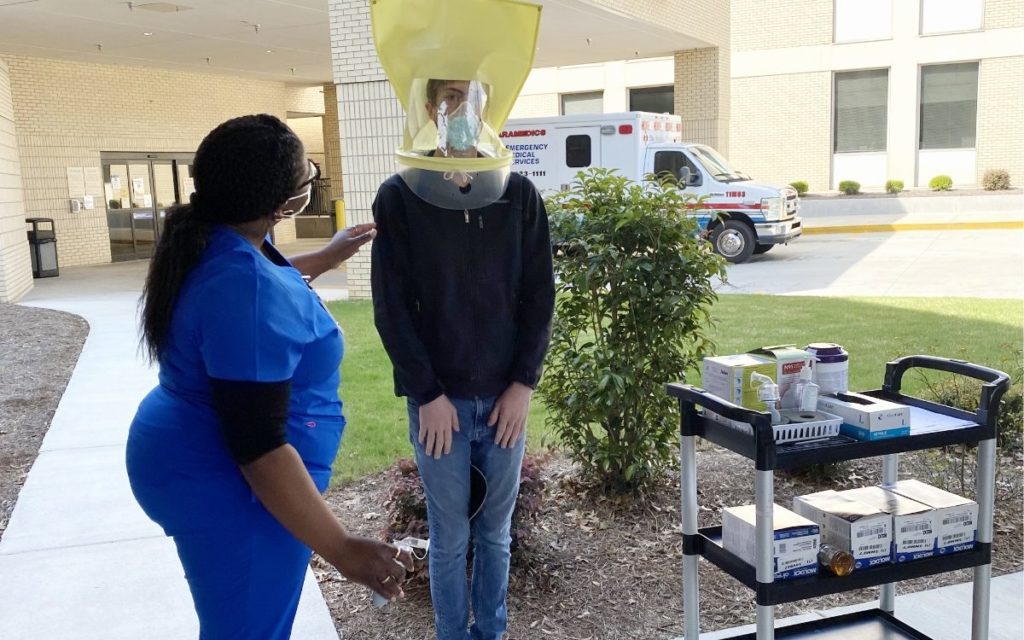 A person tries on a medical mask
