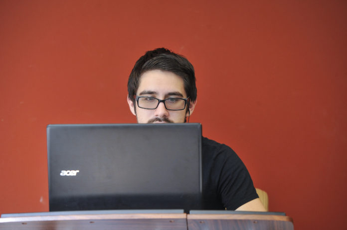 Student sits at a computer
