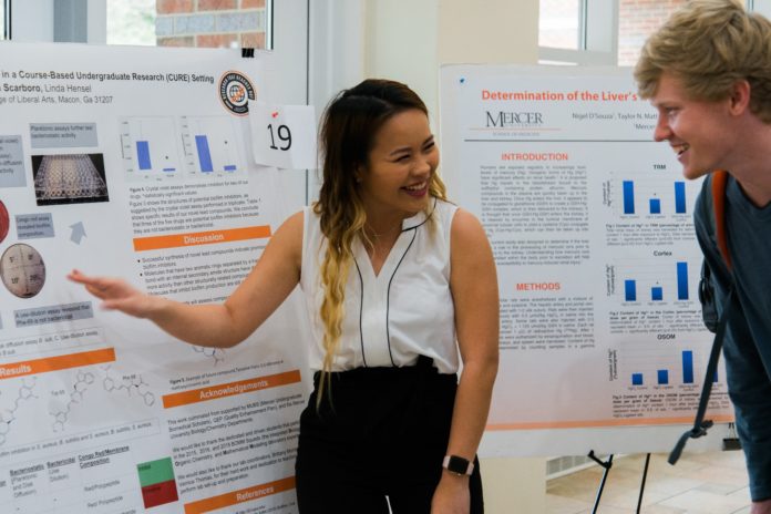 A student shows her work at BEAR Day 2019.