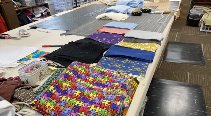 Mercer costume designer aims to sew the curve flat Cloth that will be sewn into masks