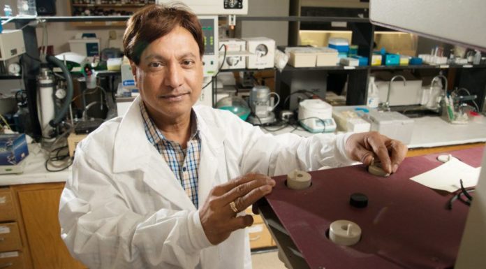 College of Pharmacy researcher investigating COVID-19 vaccine Martin D'Souza in his lab