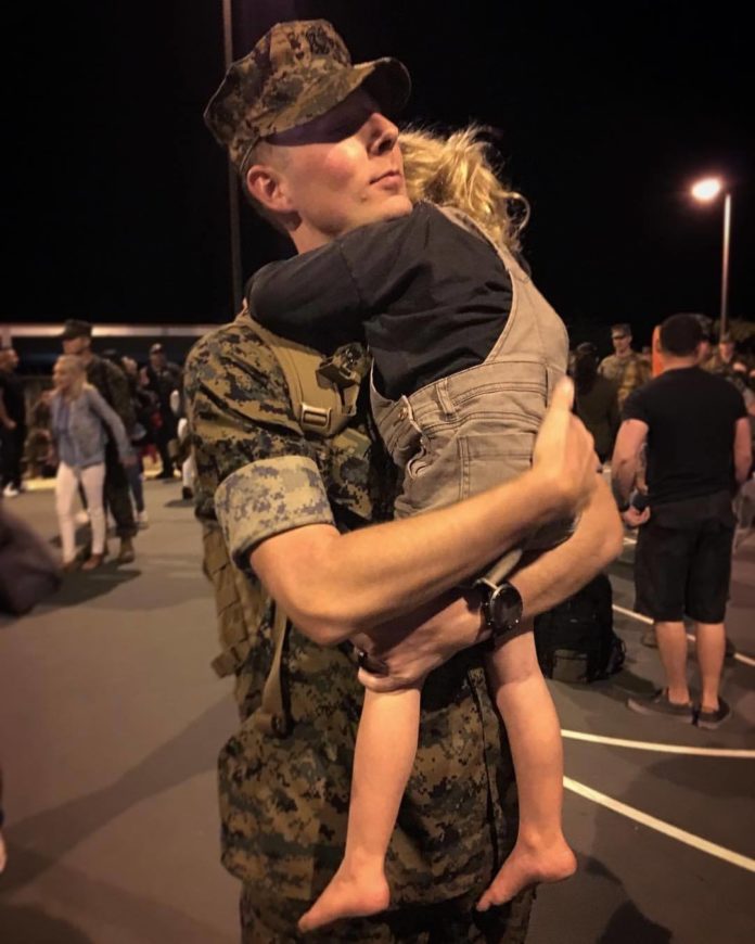 Chaplain Shawn Redmon hugs his daughter after seeing her for the first time after an eight-month deployment with the 11th Marine Expeditionary Unit.