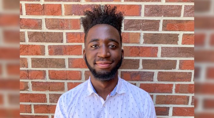 Mercer Innovation Center fellow creates quick, painless blood collection device Alan Kalinda in front of brick wall