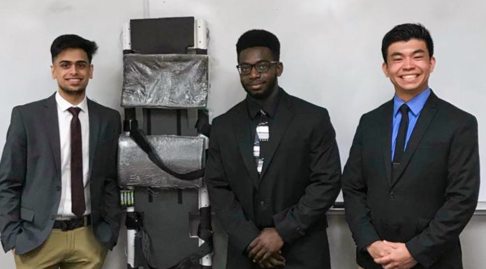 Mercerians design spinal backboard that puts patients first Three Mercer alumni stand with a spinal back board