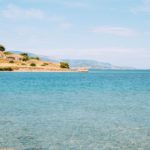 How to go on vacation while taking online classes | Ask Kelly Water with land in the distance