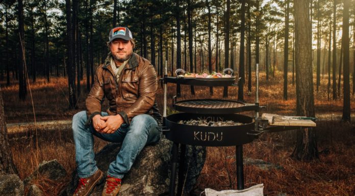 Alumnus creates grill loved by home cooks and the pros | Mercer Made Stebin Horne sits next to Kudu Grill