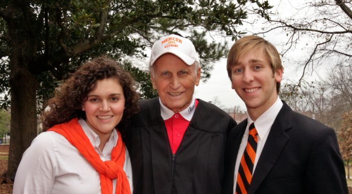 Alumnus’ role as coach portrayed in ‘Remember the Titans’ | Mercer Made Bill Yoast stands between a woman and a man