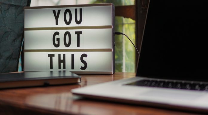Don’t let 2020’s challenges keep you from reaching your goals | Ask Kelly sign that says "you got this" next to black and white laptop