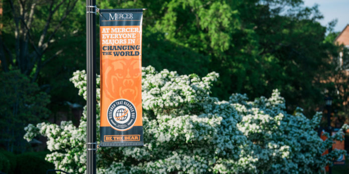 Banner on campus reads: At Mercer, everyone majors in changing the world