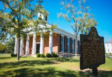 Mercer board elects new trustees, officers; approves degree in occupational therapy A historical marker noting "Old Mercer" is in front of a brick building with white columns