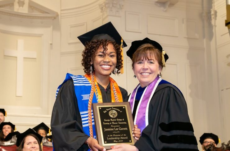 Jasmine Garrett is pictured with College of Nursing Dean Linda Streit after winning the leadership award during graduation in May 2019.
