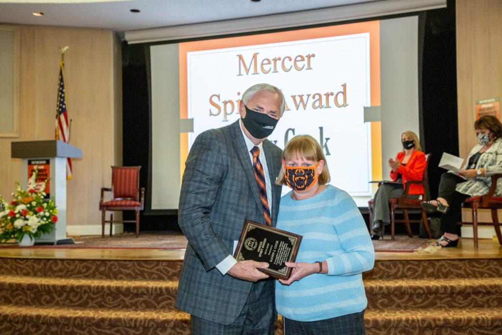 President Underwood hands Kandy Cook an award plaque