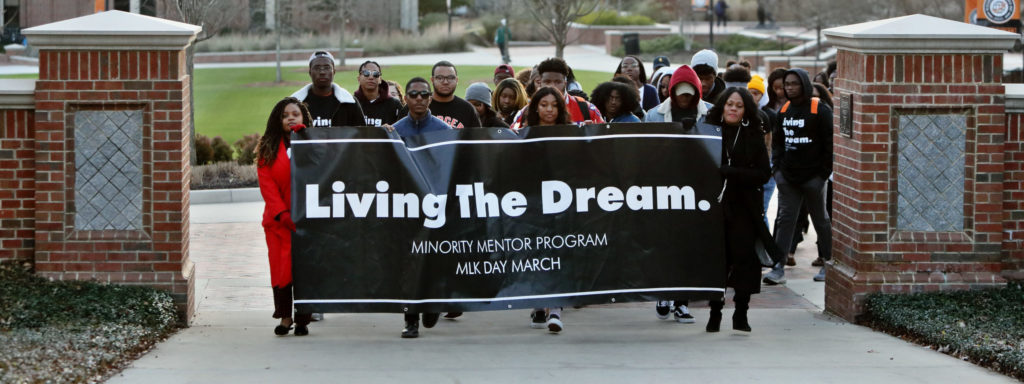 Mercerians march across the Macon campus for the Martin Luther King Jr. Living the Dream event in January 2020. [Photo taken prior to the COVID-19 pandemic.]