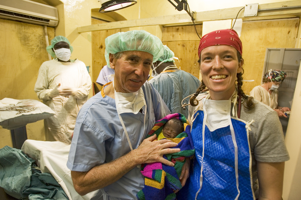Dr. Richard Furman is shown with a baby after a c-section in Kenya.