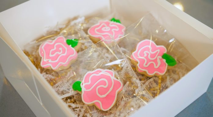 Mercer employee finds creative outlet in cookie decorating| Beyond the Bear Sugar cookies decorated as pink flowers