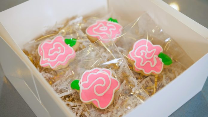 Sugar cookies decorated as pink flowers