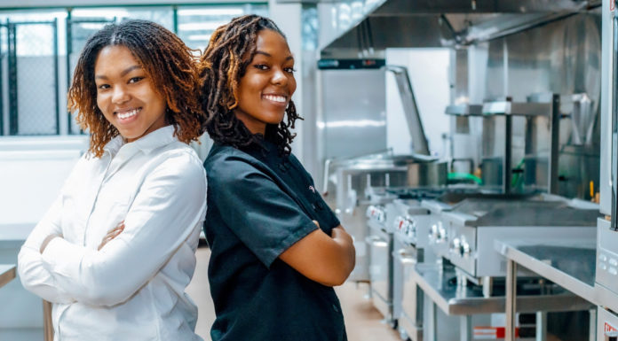 Mercer alumna uses business skills to help vegan bakery thrive | Mercer Made Two women stand back to back in a kitchen