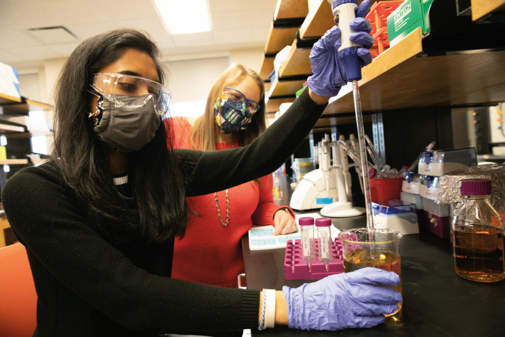 Dr. Emilianne Limbrick (right), assistant professor of chemistry, College of Liberal Arts and Sciences, and Shailey Shah, senior, biochemistry and molecular biology major.