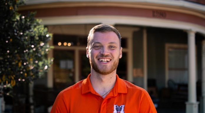 Graduate Spotlight: Fuller Tice A male student smiles at the camera while wearing a Mercer shirt