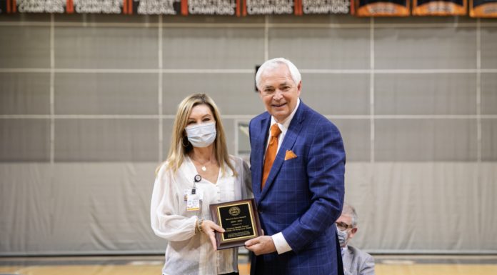 New Mercer Hero Award honors COVID-19 responders woman accepts plaque from man