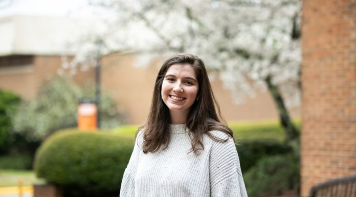 Goldwater Scholar aims to provide sustainable solutions to global water crisis Woman wearing a white sweater stands outside smiling