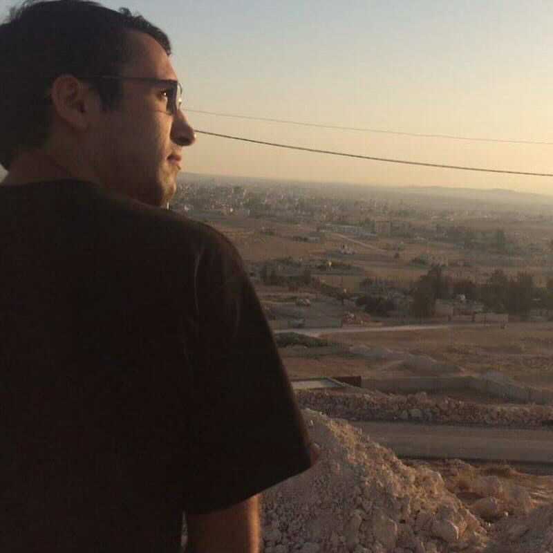 Abraham Balawi is pictured in Jordan, where his father is from and his family lived for a time before moving back to South Carolina, a few weeks before his death in 2017. Per his wishes, Abraham was buried on the other side of this mountain.