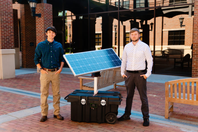 Spencer Lowe and Trenton Williams with their Solar Turtle generator.