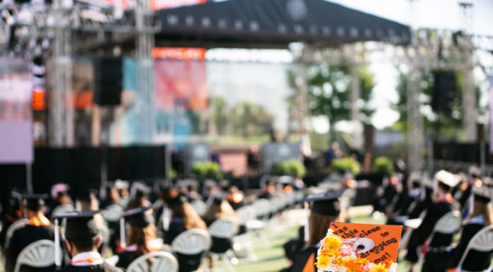 College is taking longer than I thought. Should I give up? | Ask Kelly A decorated graduation cap reads: I was this close to dropping out