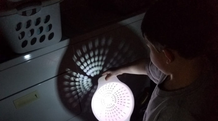 Class helps future teachers tap into their childlike wonder of science a child holds is standing in the dark and pointing a flashlight at a colander, making a shadow