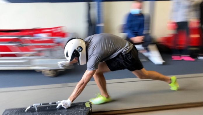 Lake Placid training 2 A man pushes a training sled