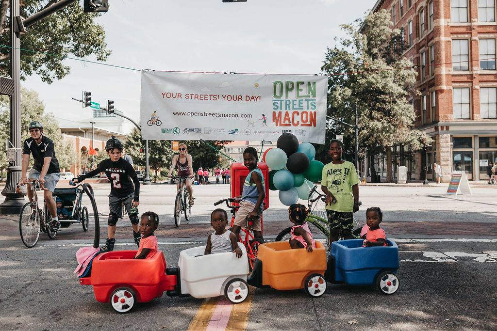 Area residents ride bikes and participate in other activities during Open Streets Macon.