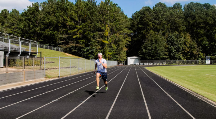 Grad student one step closer to Winter Olympics in thrilling sport | Beyond the Bear A man runs on a track