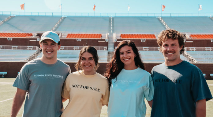 Traffick Jam innovates curriculum as it educates youth about sex trafficking Four Mercer students model Traffick Jam T-shirts