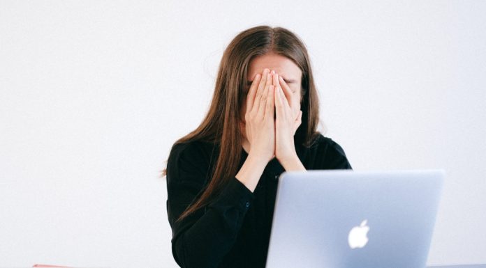 Don’t let fear of tests keep you from what you really want to do | Ask Kelly woman with hands on her face in front of a laptop