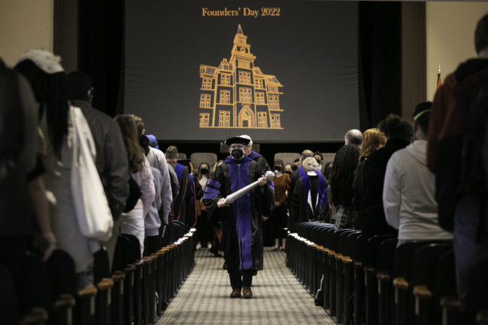 Dr. Tom Scott leads administrators and faculty out of Willingham Auditorium after the Founders' Day 2022 program.