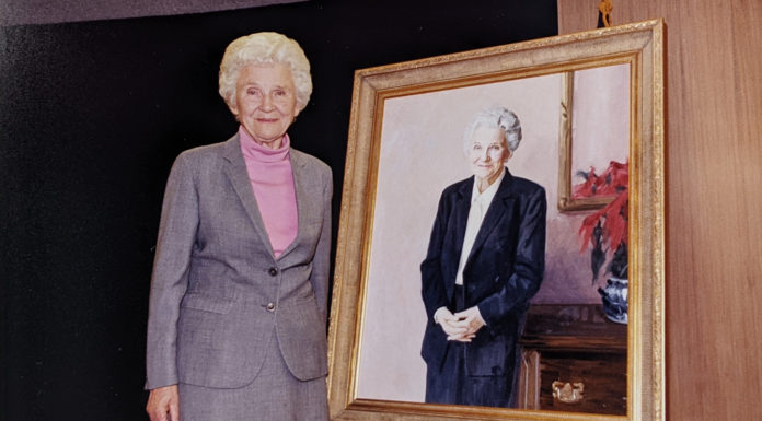 Dr. Jean Hendricks among University’s most beloved faculty members | Mercer Legends A woman stands next to a portrait of herself