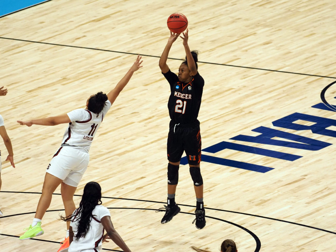 Mercer women's basketball player shoots a basketball