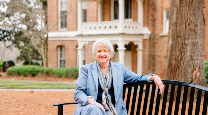 Dr. Anita Gustafson advocates for the value of a liberal arts education | Women Who Lead Anita Gustafson sits on a bench