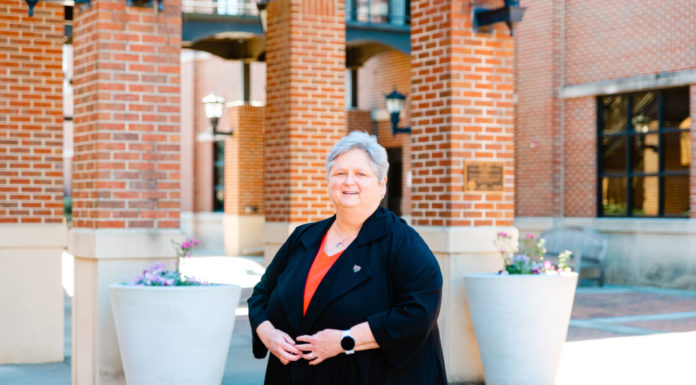 Engineering dean passionate about engaging students in meaningful research | Women Who Lead Dr. Laura Lackey stands in front of the Engineering Building at Mercer University