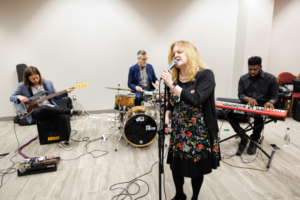 Kim Meeks, School of Medicine director of library and information science (at front), on vocals; and Macon musicians (from left) Michael Sanders, on bass; John Brainard, on drums; and Reese Kitchens, on keyboard, played as a jazz ensemble during lunch for the “Nurturing the Inner Healer” workshop on the School of Medicine’s Macon campus on March 8.