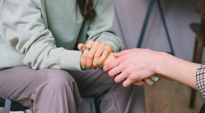 What to do when personal challenges start to interfere with schoolwork | Ask Kelly Crop psychologist supporting patient during counseling indoors