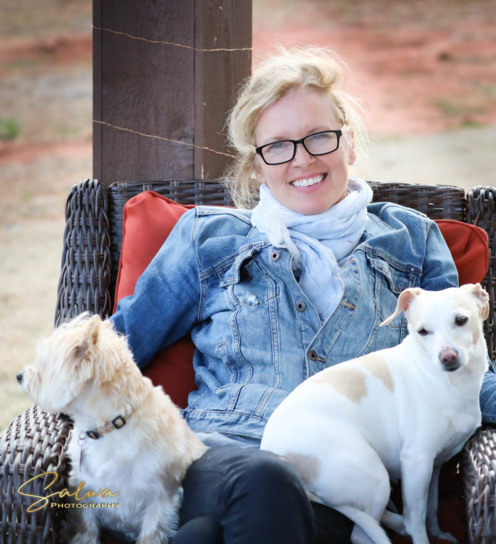 Mercer adjunct art professor Yvonne Gabriel is pictured with her two dogs.