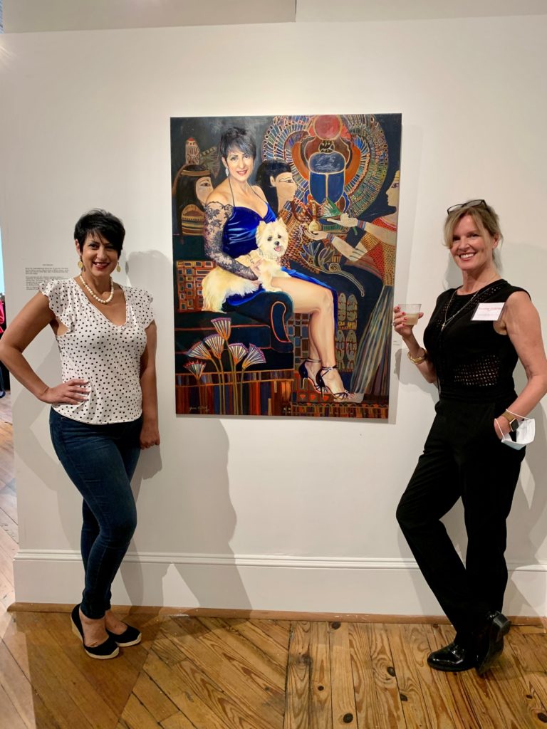 Salwa Megally and Yvonne Gabriel are pictured with the portrait she created of Megally, her best friend.