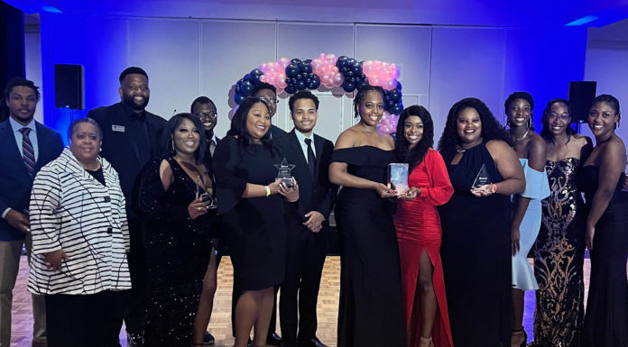 Mercer Law BLSA named regional chapter of the year Group of students posing with award trophy.